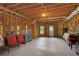 Unfinished basement with exposed ceiling beams, concrete flooring, and a walkout door at 9115 Nesbit Lakes Dr, Alpharetta, GA 30022
