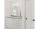 Bathroom vanity featuring a marble countertop and modern fixtures at 9115 Nesbit Lakes Dr, Alpharetta, GA 30022