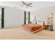 Minimalist bedroom with plush bed, modern lighting, and neutral decor at 9115 Nesbit Lakes Dr, Alpharetta, GA 30022