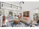 Bright living room with hardwood floors, sofas, and high ceilings, creating an inviting and spacious atmosphere at 9115 Nesbit Lakes Dr, Alpharetta, GA 30022