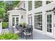 Outdoor patio with a metal dining set, perfect for alfresco dining and entertaining guests at 9115 Nesbit Lakes Dr, Alpharetta, GA 30022