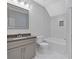 Bathroom with white hexagonal tile, gray vanity, and a framed mirror at 12 Cedar Gate Ln, Kingston, GA 30145