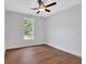 Bedroom showcasing hardwood floors, a ceiling fan, and a natural light window at 12 Cedar Gate Ln, Kingston, GA 30145