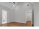 Bright bedroom boasts wood floors, neutral paint, and doorways to a bathroom and another room at 12 Cedar Gate Ln, Kingston, GA 30145