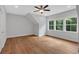 Bedroom featuring hardwood floors, a ceiling fan, and multiple windows at 12 Cedar Gate Ln, Kingston, GA 30145