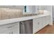 Modern kitchen featuring white cabinets, stainless appliances, and a white countertop at 12 Cedar Gate Ln, Kingston, GA 30145