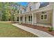 Inviting front porch with white columns, offering ample space for relaxing and enjoying the outdoors at 12 Cedar Gate Ln, Kingston, GA 30145