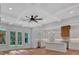 Open-concept living space with a view of the kitchen and French doors to the outside at 12 Cedar Gate Ln, Kingston, GA 30145