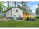 Large grassy backyard with a new deck and stairs at 1355 Tucker Woods Dr, Norcross, GA 30093