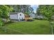 Spacious backyard showcasing lush green grass, a new deck and stairs at 1355 Tucker Woods Dr, Norcross, GA 30093