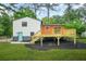 Large backyard with deck and stairs, ideal for outdoor living and entertaining at 1355 Tucker Woods Dr, Norcross, GA 30093