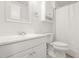 Clean bathroom with white cabinets, a sink, a toilet, and a shower with a curtain at 1355 Tucker Woods Dr, Norcross, GA 30093