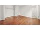 Simple bedroom with a closet and a doorway to an adjoined, clean bathroom at 1355 Tucker Woods Dr, Norcross, GA 30093