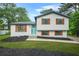 Charming two-story home featuring a freshly painted exterior and colorful shutters for added curb appeal at 1355 Tucker Woods Dr, Norcross, GA 30093