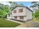 Charming two-story home featuring a freshly painted exterior and colorful shutters for added curb appeal at 1355 Tucker Woods Dr, Norcross, GA 30093