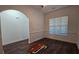 Freshly painted bedroom featuring a hardwood floor, and large window bringing in soft natural light at 2275 Copper Trail Ln, Buford, GA 30519