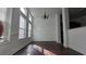 The dining area features dark wood floors, wainscoting, large bright windows and space for entertaining at 2275 Copper Trail Ln, Buford, GA 30519