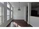 Well-lit dining room featuring dark wood floors, wainscoting, and multiple windows provides an inviting atmosphere at 2275 Copper Trail Ln, Buford, GA 30519