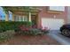 Charming home with brick accent, trimmed shrubbery, a manicured lawn and a two car garage at 2275 Copper Trail Ln, Buford, GA 30519