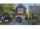 Charming brick two-story home with a two-car garage, a well-maintained lawn, and a driveway for extra parking at 2275 Copper Trail Ln, Buford, GA 30519