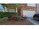 Charming home with brick accent, trimmed shrubbery, a manicured lawn and a two car garage at 2275 Copper Trail Ln, Buford, GA 30519