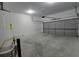 Spacious two car garage with concrete floor and modern door at 2275 Copper Trail Ln, Buford, GA 30519