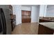 Charming kitchen with stainless steel appliances, brown cabinetry and granite countertops at 2275 Copper Trail Ln, Buford, GA 30519