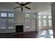 Spacious living room with fireplace, and large windows offers tons of natural light and lovely outdoor views at 2275 Copper Trail Ln, Buford, GA 30519