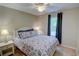 Cozy bedroom features a large window, plush bedding, and neutral walls perfect for creating a relaxing atmosphere at 3381 Grovewood Ln, Duluth, GA 30096