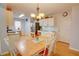 Eat-in kitchen with breakfast table and bright white cabinets at 3381 Grovewood Ln, Duluth, GA 30096