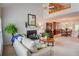 Open-concept living space with fireplace, tall ceilings, lots of natural light, and seamless flow to the dining area at 3381 Grovewood Ln, Duluth, GA 30096