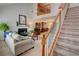 Bright living room featuring a fireplace, staircase, and soaring ceilings, creating an inviting and spacious atmosphere at 3381 Grovewood Ln, Duluth, GA 30096