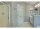 Clean, bright bathroom offers a walk-in shower, modern vanity, and ample storage for a functional yet stylish space at 3381 Grovewood Ln, Duluth, GA 30096