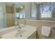Well-lit bathroom with a modern vanity, soaking tub, and stylish decor creating a serene and inviting atmosphere at 3381 Grovewood Ln, Duluth, GA 30096