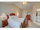Relaxing main bedroom features a cozy ambiance with a large window and plush bedding for restful nights at 3381 Grovewood Ln, Duluth, GA 30096