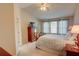Bright main bedroom boasts vaulted ceilings, large windows, and ample closet space for comfortable living at 3381 Grovewood Ln, Duluth, GA 30096