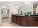 Bathroom features double vanity, granite countertops, and a separate dressing area at 4120 Winterberry Rd, Cumming, GA 30040