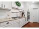 Gourmet kitchen offers granite countertops, a gas range, and stainless steel appliances at 4120 Winterberry Rd, Cumming, GA 30040
