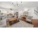 Spacious living room featuring hardwood floors, a cozy seating area, and seamless flow to kitchen at 4120 Winterberry Rd, Cumming, GA 30040