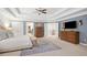 Spacious main bedroom offers a trey ceiling, sitting area, and neutral decor at 4120 Winterberry Rd, Cumming, GA 30040