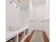 Well-organized mudroom with bench seating, storage baskets, and convenient hooks at 4120 Winterberry Rd, Cumming, GA 30040