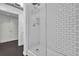Modern bathroom with white subway tile shower, glass enclosure, and contemporary fixtures at 510 Edgewood Ne Ave # 6, Atlanta, GA 30312
