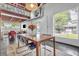 Bright dining area features modern table with chairs, large windows, and open layout to the living spaces at 510 Edgewood Ne Ave # 6, Atlanta, GA 30312