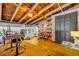 Stylish home office featuring exposed wood beams, hardwood floors, built-in bookshelves, and a comfortable workspace at 510 Edgewood Ne Ave # 6, Atlanta, GA 30312