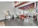 Large living area with exposed ceiling, industrial ductwork, large windows, and stylish modern furniture at 510 Edgewood Ne Ave # 6, Atlanta, GA 30312