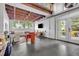 Spacious open living area features exposed ceiling beams, large windows, and a comfortable seating arrangement at 510 Edgewood Ne Ave # 6, Atlanta, GA 30312