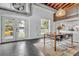 Open-concept living space with views of the outdoor area, modern kitchen, and industrial design elements at 510 Edgewood Ne Ave # 6, Atlanta, GA 30312