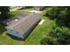 Aerial view of a home showcasing its roof, yard, and proximity to surrounding greenery at 2251 S Hairston Rd, Decatur, GA 30035