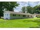 Backyard view of the home showing the large grassy yard at 2251 S Hairston Rd, Decatur, GA 30035