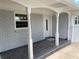 Inviting front entrance with columns, painted brick, and decorative door at 2251 S Hairston Rd, Decatur, GA 30035